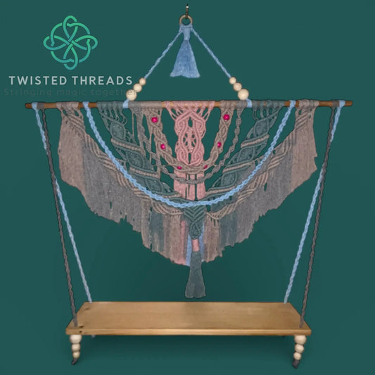 Stillwater Macrame Shelf by Twisted Threads Au, a functional fibre art piece with intricate knotting and wooden shelf, hanging decor.