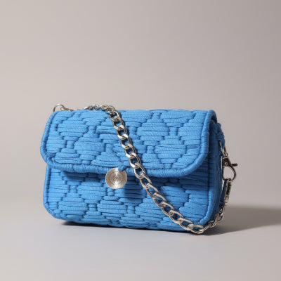 Sapphire blue Threadline 05 mini clutch handbag by Twisted Threads Au featuring a sleek, compact design with a textured finish.