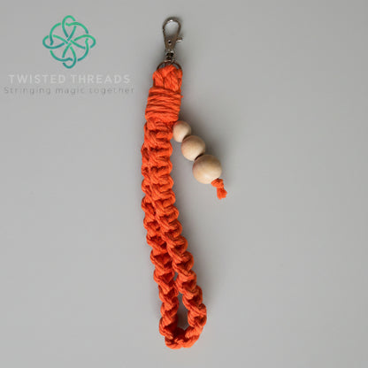 Yellow large square knot wristlet keychain from Twisted Threads Au keychain collection, featuring a woven design and metal clasp.