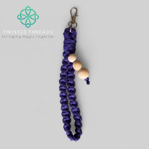 Purple large square knot macrame wristlet keychain from Twisted Threads Au, featuring intricate knot design and a sturdy keyring.