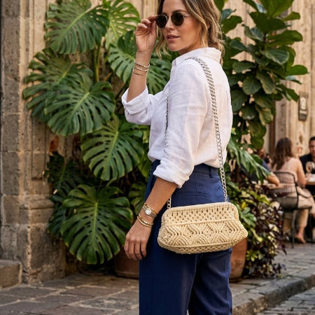 Twisted Threads Au Threadline 01 Wide Mouth Clutch handbag in leather, featuring a sleek design and wide opening, in a lifestyle setting