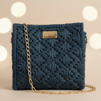 Blue denim Threadline 04 Pavilion Mini Shoulder Bag by Twisted Threads Au, featuring front stitching and a bokeh background.