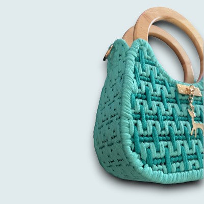 Side view of the Threadline 07 Labyrinth Loop Twisted Threads Au handbag showcasing its unique labyrinth-inspired design and sleek silhouette.