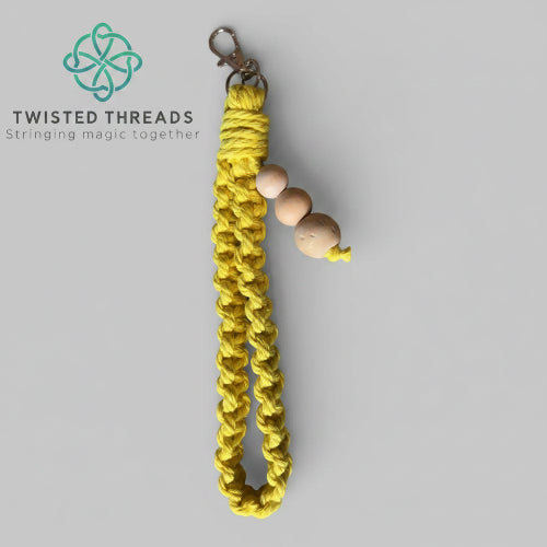 Large yellow Square Knot wristlet from Twisted Threads Au keychain collection, featuring a woven design and sturdy attachment.
